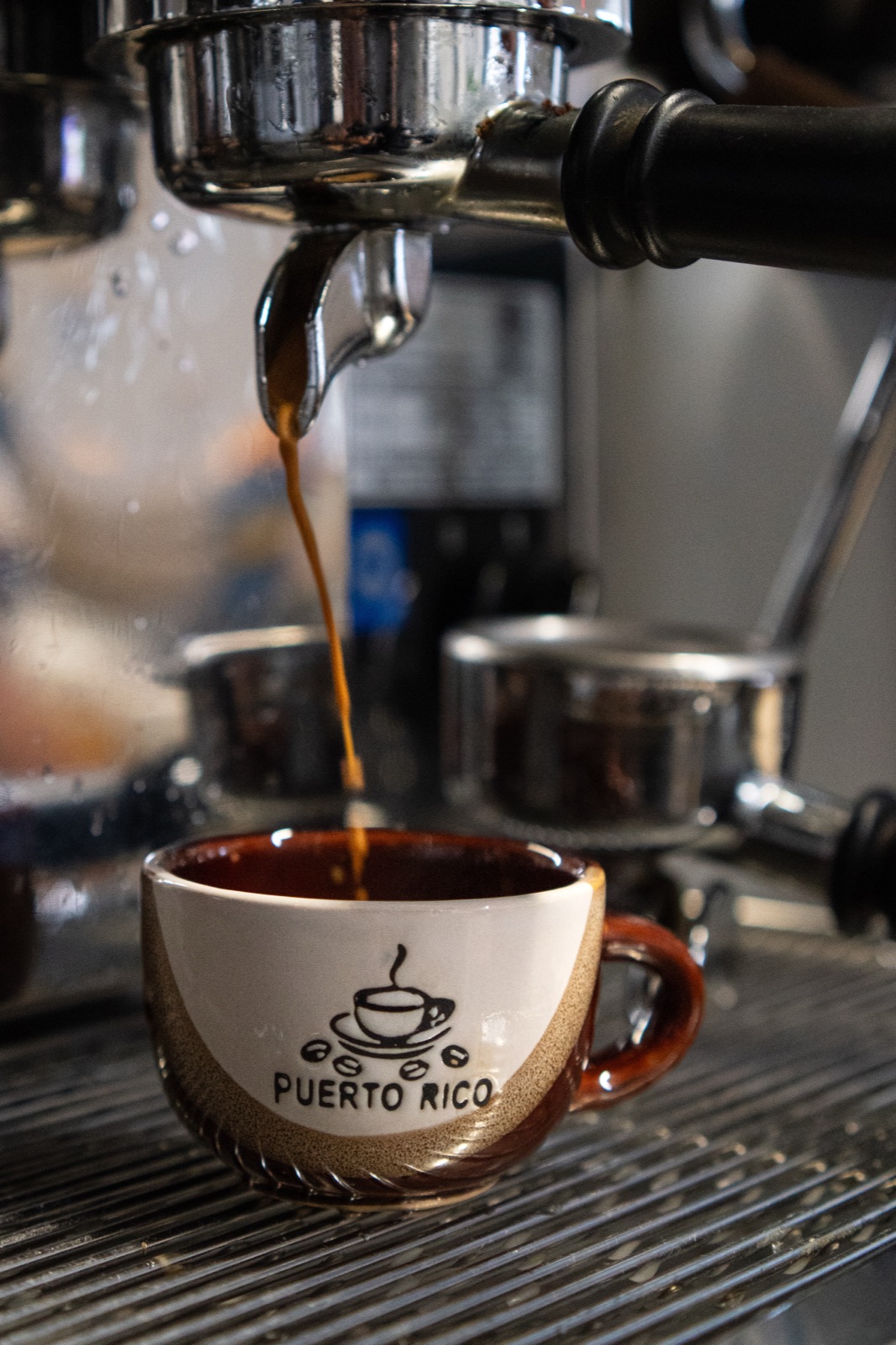 Espresso pouring into a Puerto Rico cup